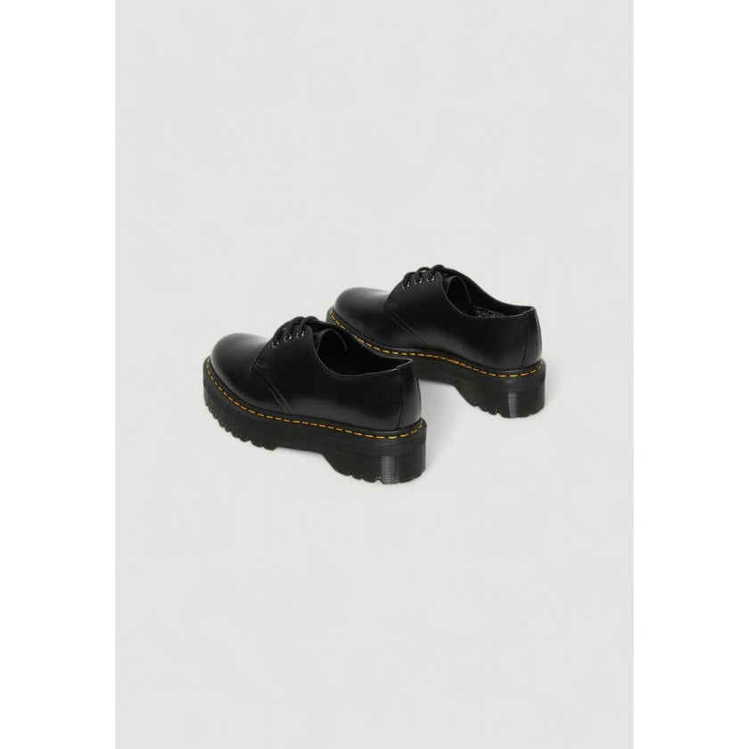 Black Leather Lace-Up BootsThe Dr. Martens 1461 QUAD 25567001 women’s lace-up shoes are a must-have for those seeking style and comfort. Made from 100% high-quality leather, these shoes offer exceptional durability and an iconic look. The classic design i