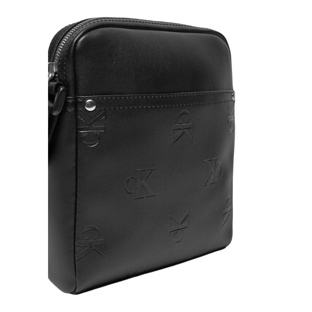 Black Polyethylene Messenger BagThe Calvin Klein Jeans AOP REPORTER K50K512564 men’s crossbody bag is the perfect accessory for those seeking style and functionality. Made from 100% polyurethane, this bag is durable and easy to clean, making it ideal for
