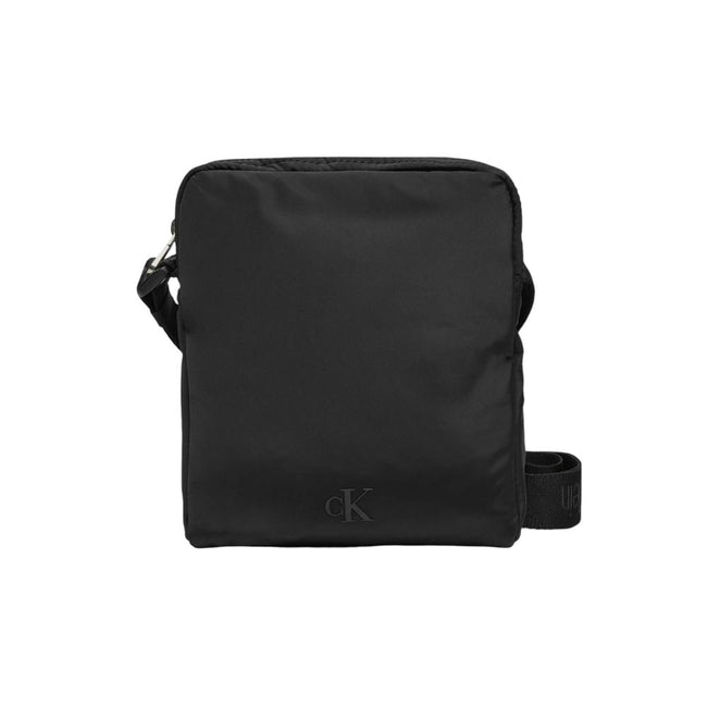 Black Recycled Polyester Messenger BagDiscover the Calvin Klein OVER WEBBING REPORTER18 NY K50K512567 men’s shoulder bag, an elegant and practical accessory for the modern man. Made from 100% recycled polyester, this bag combines sustainability with style