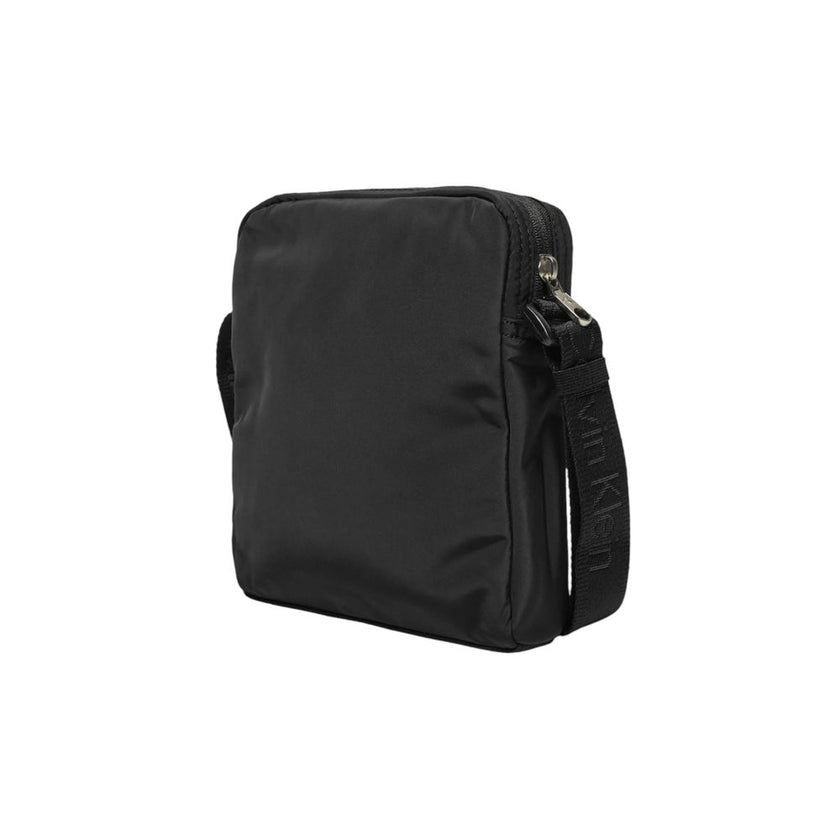 Black Recycled Polyester Messenger BagDiscover the Calvin Klein OVER WEBBING REPORTER18 NY K50K512567 men’s shoulder bag, an elegant and practical accessory for the modern man. Made from 100% recycled polyester, this bag combines sustainability with style