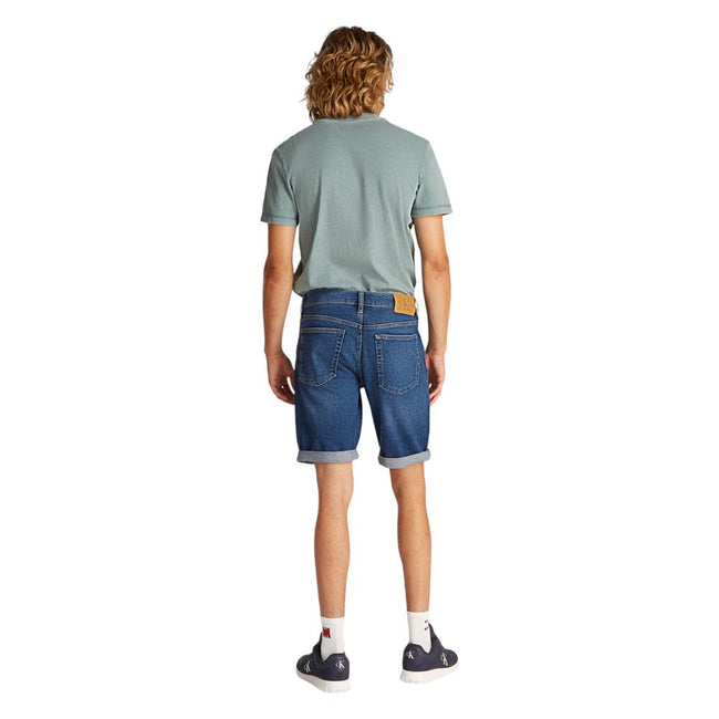 Blue Cotton Bermuda ShortsThe Calvin Klein Jeans J30J327184 men’s bermuda shorts are perfect for those seeking a casual and modern look. Made from a blend of 94% cotton, 4% elastomultiester, and 2% elastane/lycra, these shorts provide a slim fit that hugs