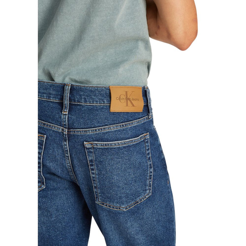 Blue Cotton Bermuda ShortsThe Calvin Klein Jeans J30J327184 men’s bermuda shorts are perfect for those seeking a casual and modern look. Made from a blend of 94% cotton, 4% elastomultiester, and 2% elastane/lycra, these shorts provide a slim fit that hugs