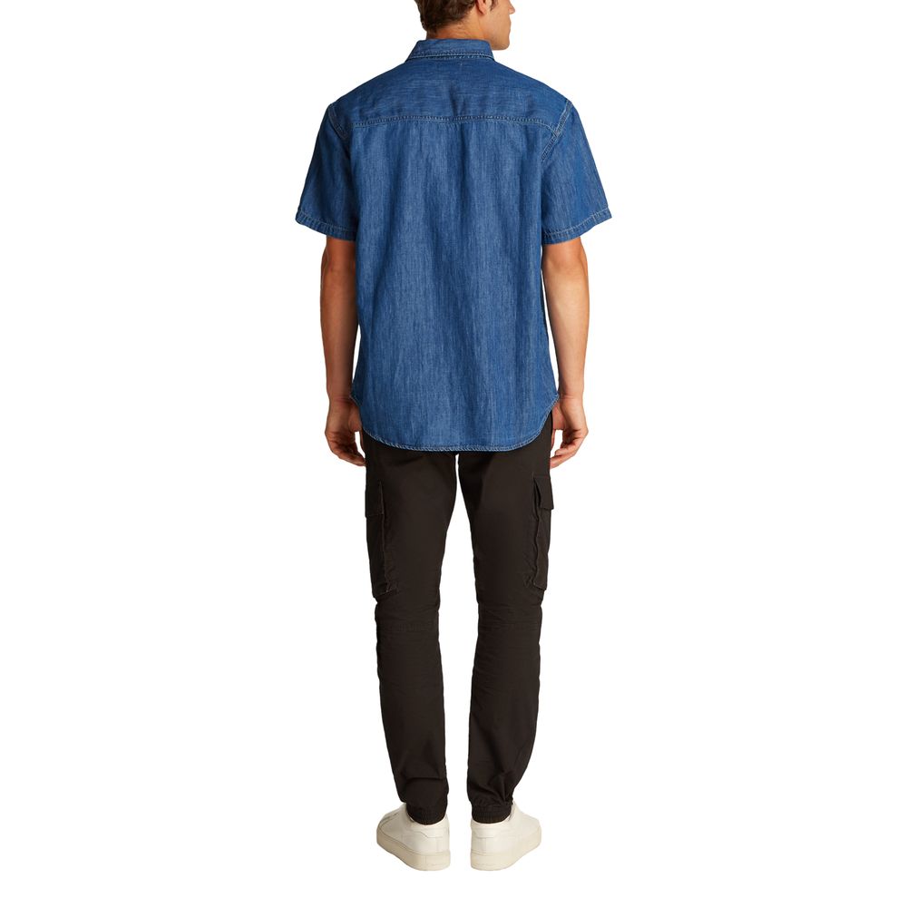 Blue Cotton ShirtDiscover the Calvin Klein Jeans REGULAR SS DENIM J30J327178 long-sleeve shirt for men, a versatile and stylish piece of clothing. Made with an innovative blend of materials, this shirt features 47% cotton, 20% recycled cotton, 19% linen,