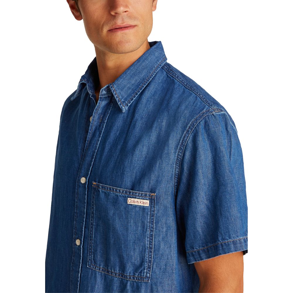 Blue Cotton ShirtDiscover the Calvin Klein Jeans REGULAR SS DENIM J30J327178 long-sleeve shirt for men, a versatile and stylish piece of clothing. Made with an innovative blend of materials, this shirt features 47% cotton, 20% recycled cotton, 19% linen,