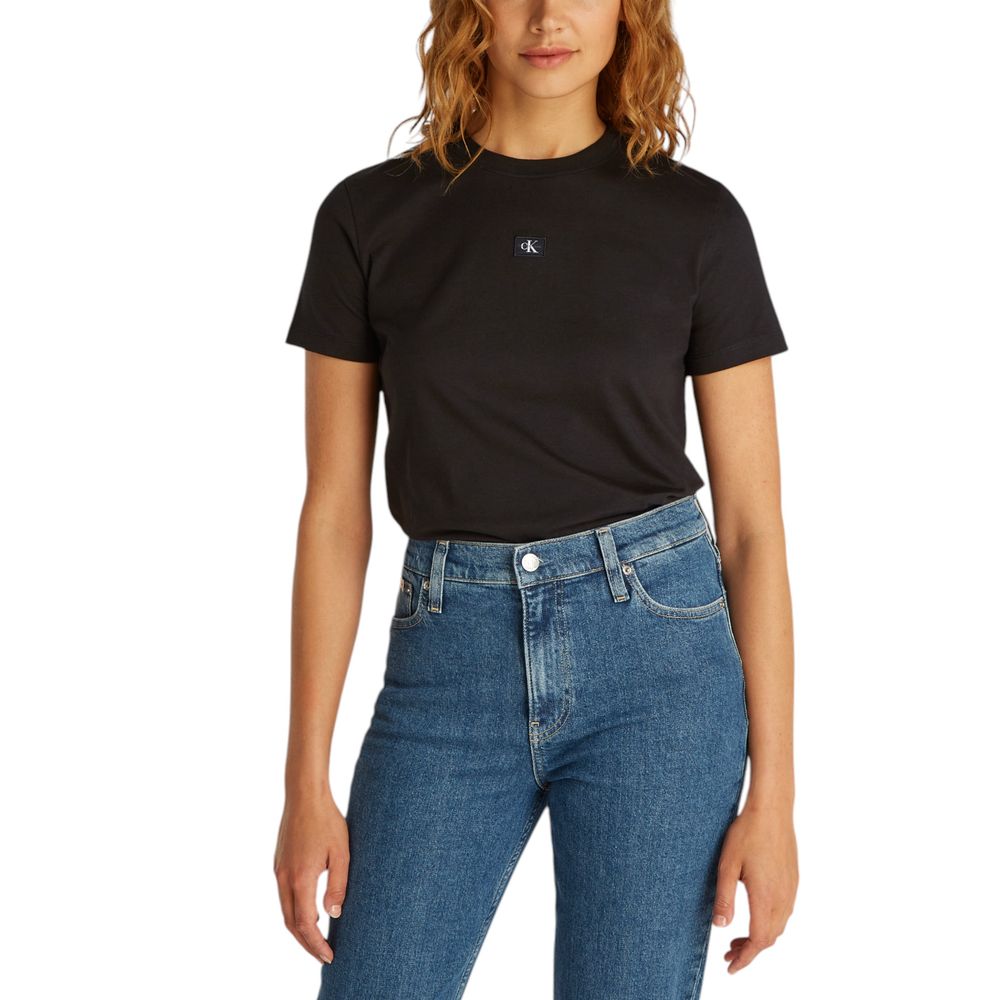 Black Recycled Cotton T-ShirtDiscover the Calvin Klein Jeans WOVEN LABEL REGULAR short-sleeve t-shirt for women, an essential piece for your wardrobe. Made from 100% recycled cotton, this t-shirt provides a soft and comfortable feel against the skin. The