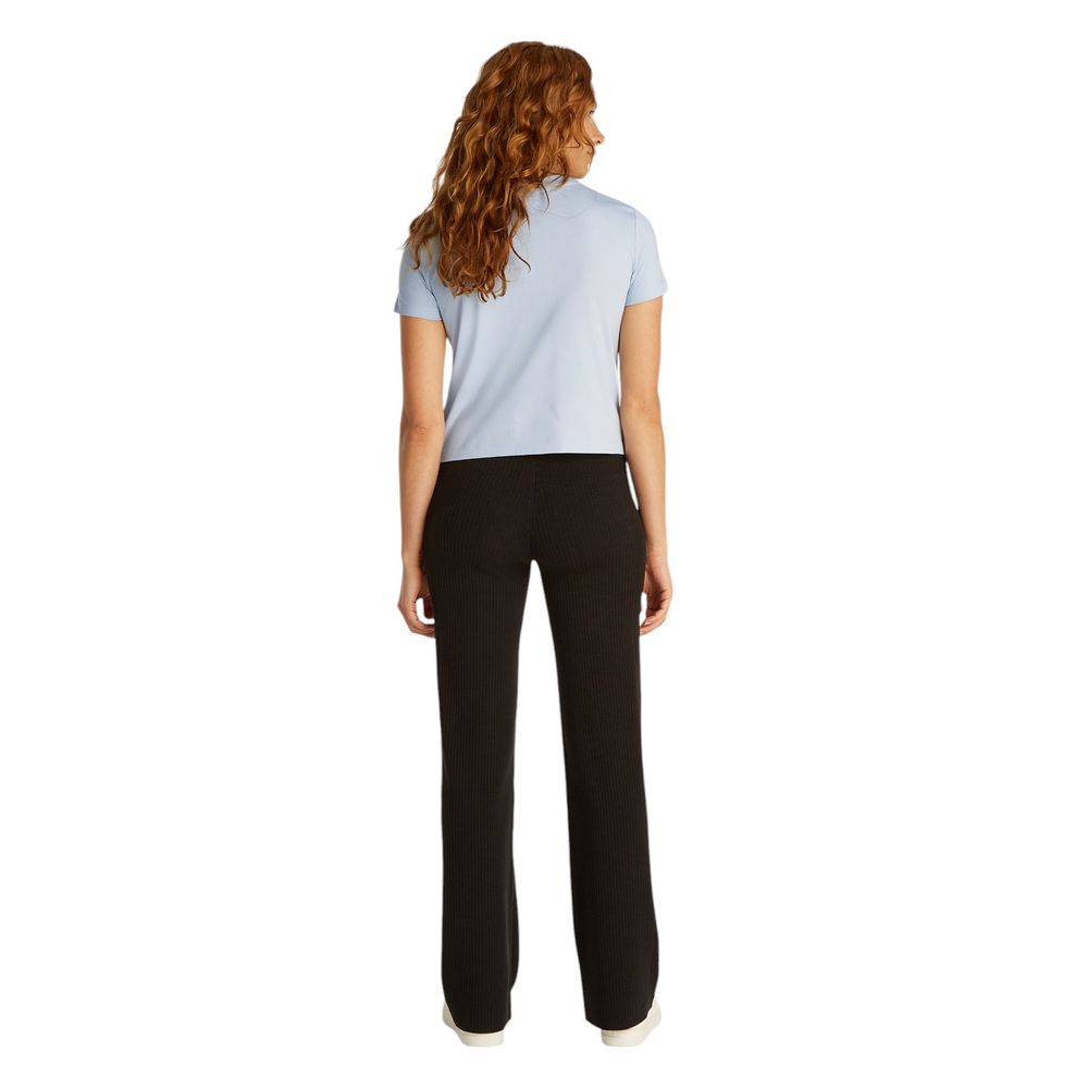 Blue Recycled Cotton T-ShirtDiscover the short-sleeve women’s t-shirt by Calvin Klein Jeans, a clothing item that combines style and sustainability. Made from 100% recycled cotton, this t-shirt is perfect for those looking for a casual yet refined look. T