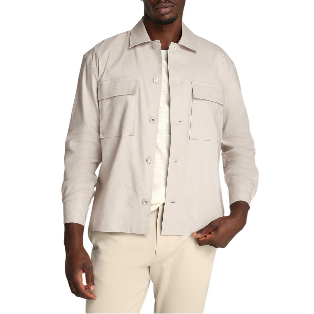 Beige Lyocell ShirtDiscover the long-sleeve men’s shirt by Calvin Klein, a clothing piece that combines elegance and practicality. Made from a refined blend of 51% Lyocell, 47% Linen, and 2% Elastane, this shirt offers exceptional comfort and a perfect fi