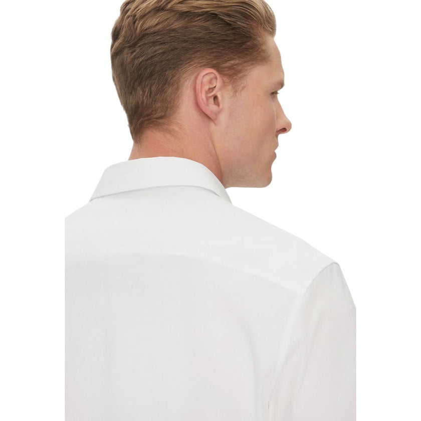 White Organic Cotton Shortsleeve ShirtDiscover the short-sleeve menâs shirt by Calvin Klein, an essential piece for your summer wardrobe. Made from a blend of 60% organic cotton, 36% cotton, and 4% elastane/lycra, this shirt provides a comfortable fit a