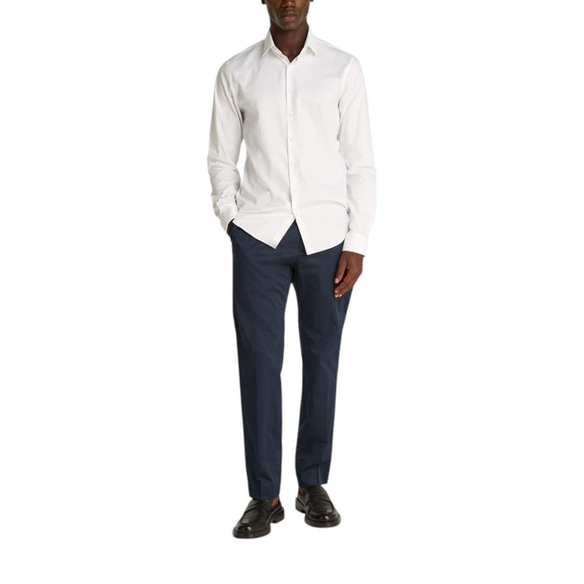 White Cotton ShirtDiscover the Calvin Klein TONAL STRUCTURE long-sleeve shirt for men, an essential piece for the male wardrobe. Made with a careful blend of 52% cotton, 44% polyester, and 4% elastane/lycra, this shirt offers a comfortable fit and a soft