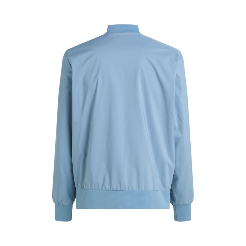 Light Blue Recycled Polyester Jackets & CoatDiscover the Matte Bomber jacket by Calvin Klein, an essential piece for the men’s wardrobe. Made from 100% recycled polyester, this bomber combines sustainability with contemporary style. The minimalist design