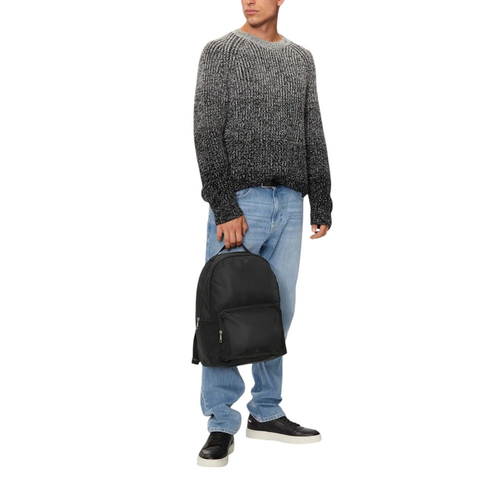 Black Recycled Polyester BackpackDiscover the Ultralight Center Zip backpack by Calvin Klein, a practical and stylish accessory made from 100% recycled polyester. This backpack is designed to provide excellent lightweight functionality without compromisin