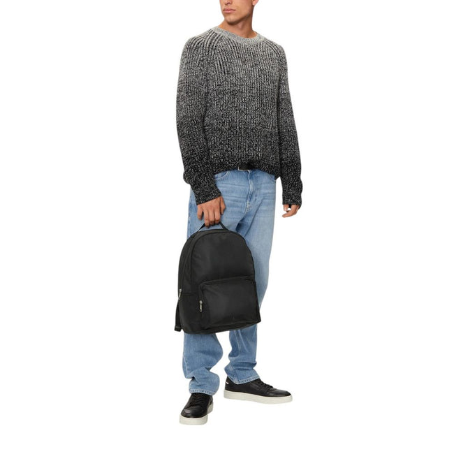 Black Recycled Polyester BackpackDiscover the Ultralight Center Zip backpack by Calvin Klein, a practical and stylish accessory made from 100% recycled polyester. This backpack is designed to provide excellent lightweight functionality without compromisin