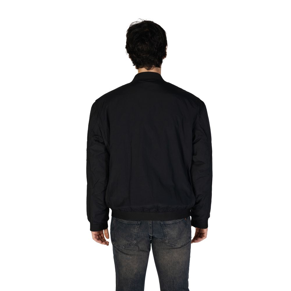Black Polyamide Jackets & CoatThe Boss Olmec 10269898 01 50536798 men’s jacket is the perfect choice for those seeking a contemporary and refined style. Crafted from a premium blend of 75% polyamide and 25% cotton, it offers durability, lightweight comfor