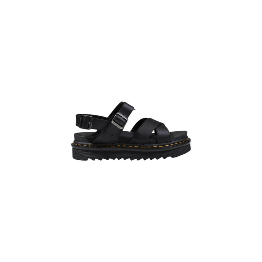 Black Leather SandalThe Dr. Martens Voss II Athena 31558001 women’s sandals are made from 100% high-quality leather, ensuring durability and longevity. This model combines style and comfort, making them perfect for any summer occasion. The rubber sole pro
