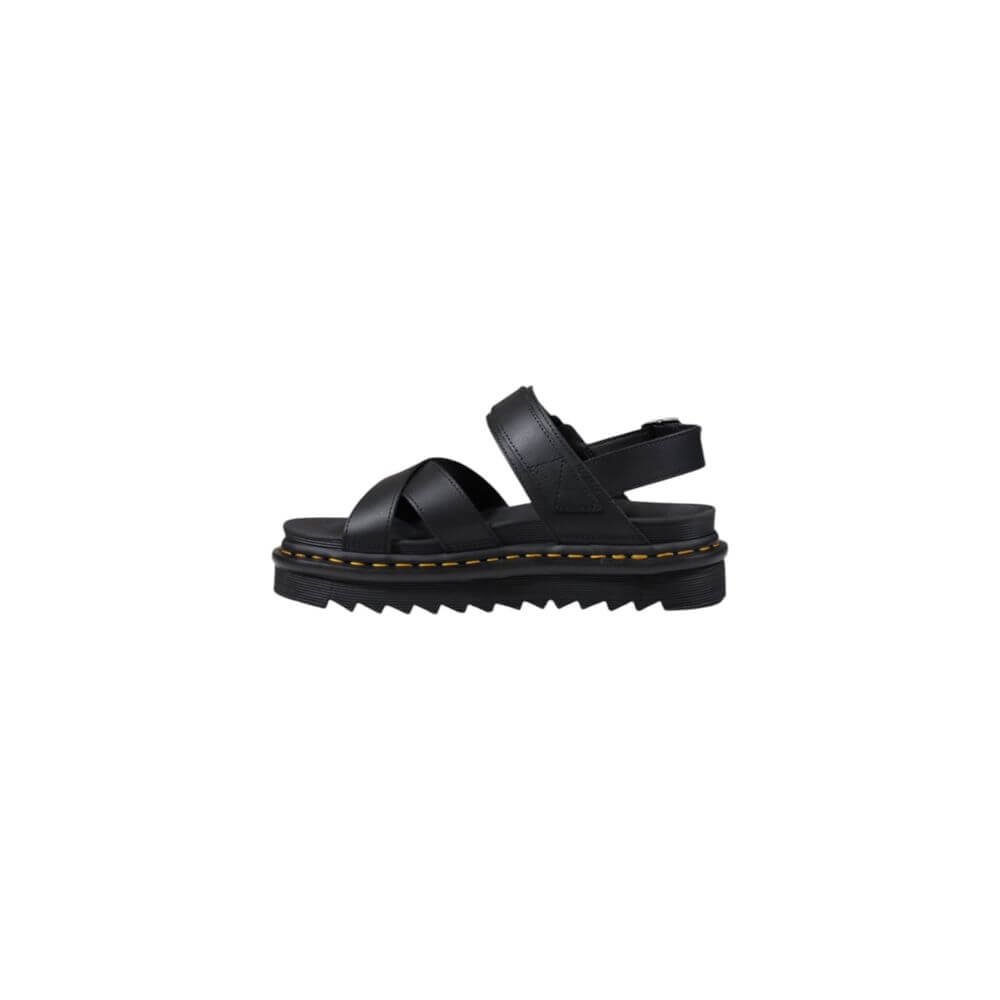 Black Leather SandalThe Dr. Martens Voss II Athena 31558001 women’s sandals are made from 100% high-quality leather, ensuring durability and longevity. This model combines style and comfort, making them perfect for any summer occasion. The rubber sole pro