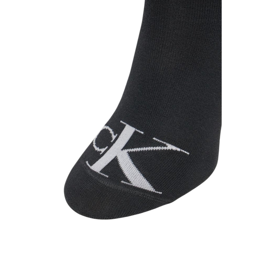 Black Cotton SocksDiscover the comfort and style of Calvin Klein Jeans women’s socks 2P MONOGRAM. Made with high-quality materials, these socks are composed of 70% cotton, ensuring unmatched softness, while the 26% polyester provides durability and resist