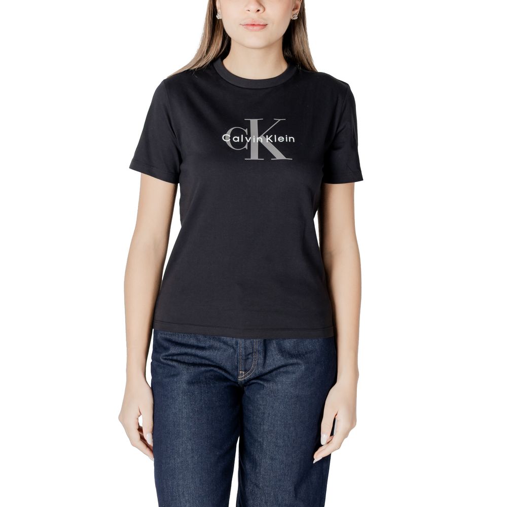 Black Cotton T-ShirtDiscover casual elegance with the short-sleeve women’s t-shirt from Calvin Klein Jeans. Made from 100% cotton, this shirt offers exceptional comfort and a soft fit against the skin. The minimalist design is enhanced by the iconic brand