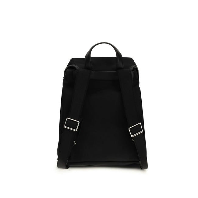 Black Nylon BackpackThe New Trick Backpack by Moncler is designed for everyday use, combining functionality and style. Made from water-repellent recycled nylon with a nylon lining, it features leather finishes and handle, adjustable shoulder straps, and a