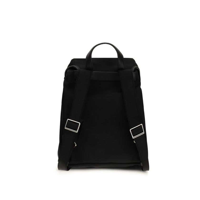 Black Nylon BackpackThe New Trick Backpack by Moncler is designed for everyday use, combining functionality and style. Made from water-repellent recycled nylon with a nylon lining, it features leather finishes and handle, adjustable shoulder straps, and a