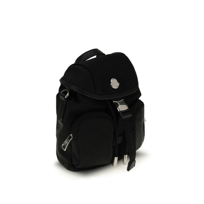Black Leather BackpackThe Trick mini bag by Moncler is a compact reinterpretation of the iconic model, designed to stylishly meet everyday needs. Made of nylon drill with a nylon lining, it is enhanced with logo details. The leather handle and adjustable