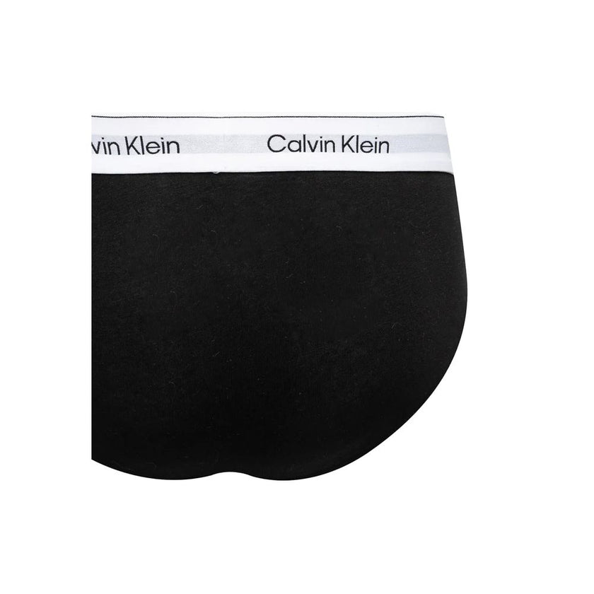 Black And White Cotton BriefsDiscover timeless comfort and style with the Calvin Klein Underwear HIP BRIEF men’s slip pack of three. Made from high-quality materials, these briefs are composed of 95% cotton and 5% elastane/lycra, ensuring a perfect fit an