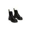 Black Leather Ankle BootsThe Jadon Polished Smooth boots by Dr. Martens are an icon of style and comfort. Made with a 100% leather upper, these boots offer exceptional durability and resistance. The lining, composed of 75% fabric and 25% leather, ensures