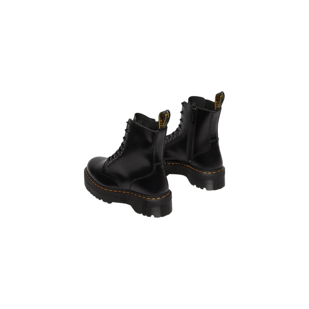 Black Leather Ankle BootsThe Jadon Polished Smooth boots by Dr. Martens are an icon of style and comfort. Made with a 100% leather upper, these boots offer exceptional durability and resistance. The lining, composed of 75% fabric and 25% leather, ensures
