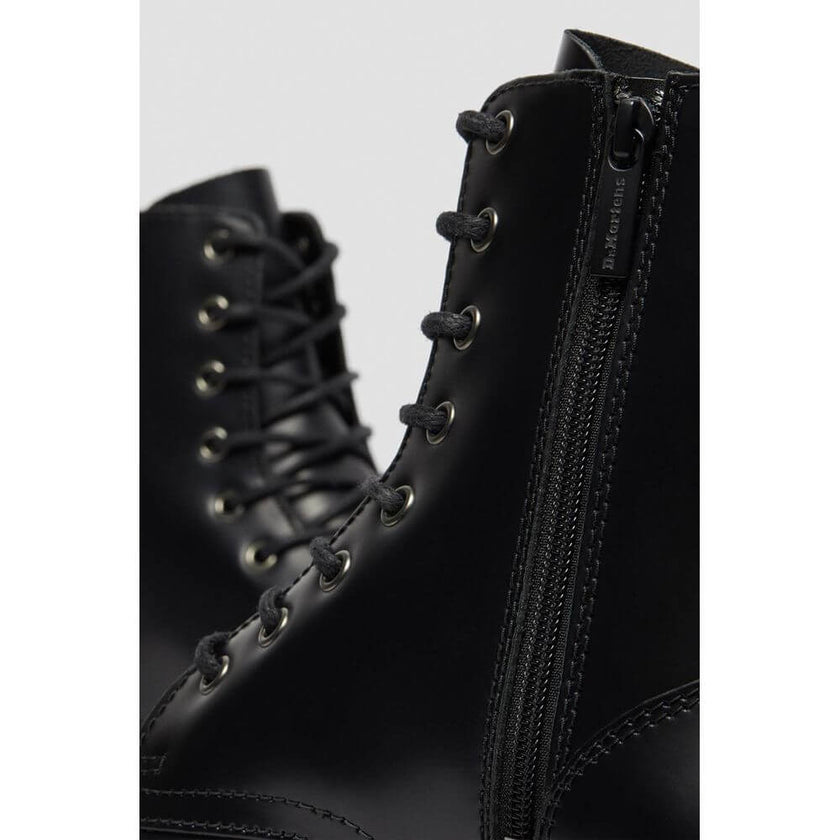 Black Leather Ankle BootsThe Jadon Polished Smooth boots by Dr. Martens are an icon of style and comfort. Made with a 100% leather upper, these boots offer exceptional durability and resistance. The lining, composed of 75% fabric and 25% leather, ensures