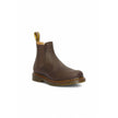 Brown Leather Ankle BootsDiscover the Dr. Martens 2976 Ys Crazy Horse men’s ankle boots, crafted from 100% high-quality leather. These boots feature an iconic design and a comfortable fit, making them perfect for any occasion. The durable rubber sole ensu