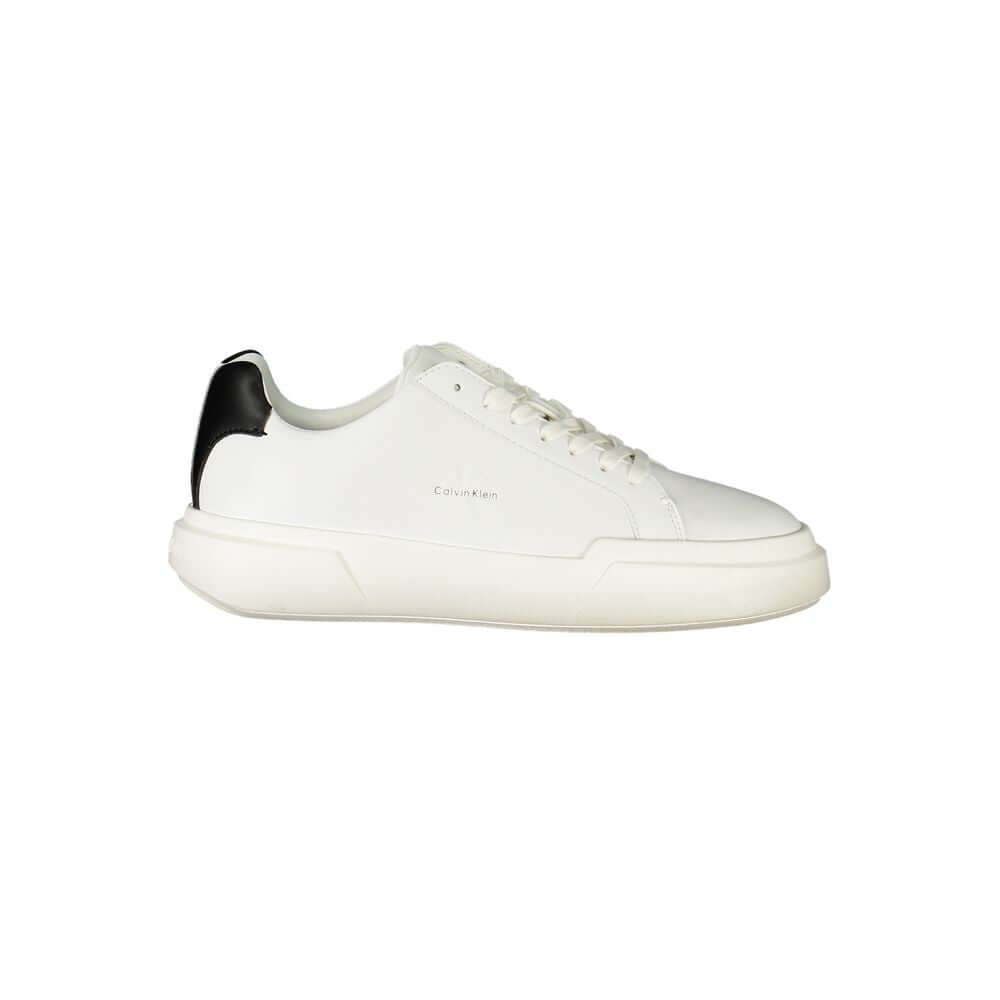 White Leather Women SneakerStep into the realm of high-end sophistication with Calvin Klein’s latest sneaker, combining athletic comfort with a chic aesthetic. White serves as the perfect canvas, accentuated by contrasting black details for an effortlessl