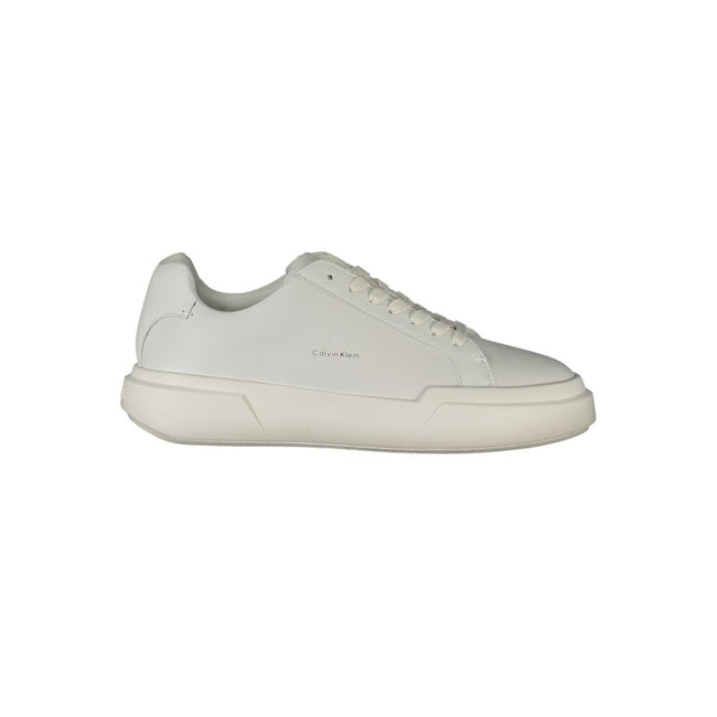 White Leather Women SneakerDare to step out in style with these Calvin Klein sneakers, where comfort meets chic in every stride. Boasting a crisp white palette and accented with the brand’s unmistakable logo, these lace-up shoes are designed to make a sta