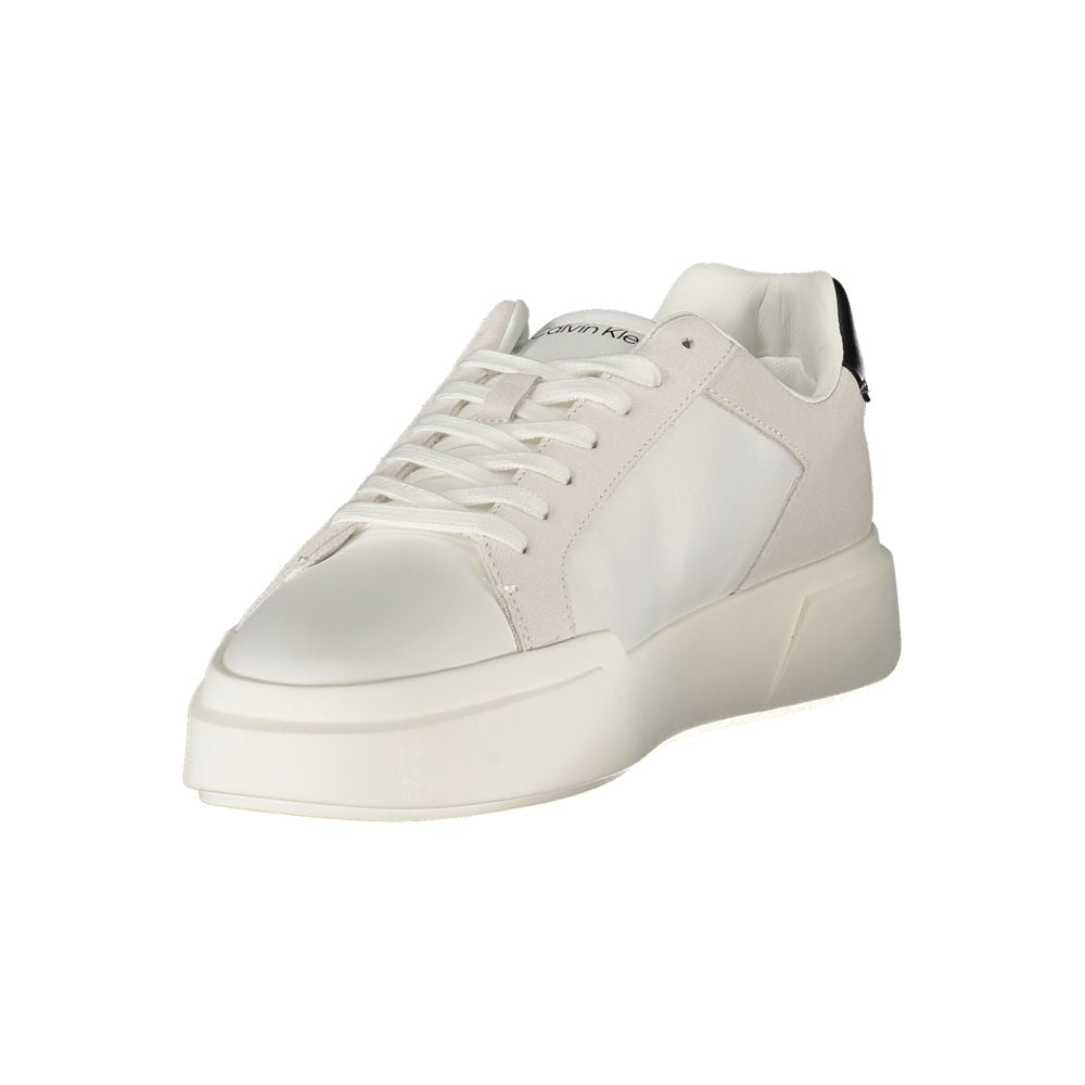 White Leather Men SneakerUnleash your stride with Calvin Klein’s latest fusion of style and comfort in these sleek sneakers. Boasting a modern design with striking black accents, they cater to those who stand confidently at the intersection of fashion and