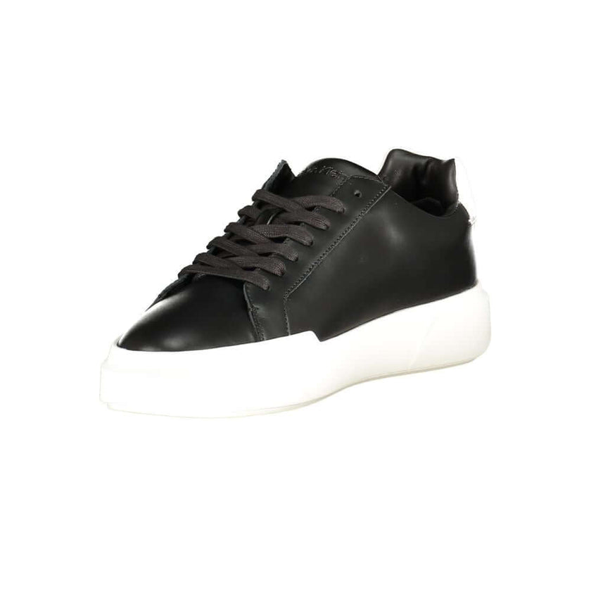 Black Leather Men's SneakerElevate your athletic ensemble with Calvin Klein’s latest offering—sleek sports shoes designed to turn heads and enhance performance. These sneakers boast a bold black base with striking white contrasts that command attention. E