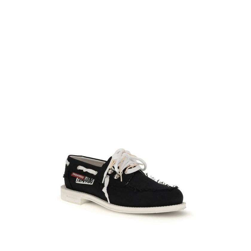 Black Cotton Slip-On LoafersThe Boat Shoes by Dsquared2 combine traditional structure with lightweight materials. Featuring a cotton upper and a white rubber sole, they offer comfort, breathability, and practicality. Ideal for those seeking a relaxed yet