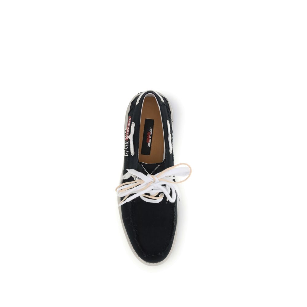 Black Cotton Slip-On LoafersThe Boat Shoes by Dsquared2 combine traditional structure with lightweight materials. Featuring a cotton upper and a white rubber sole, they offer comfort, breathability, and practicality. Ideal for those seeking a relaxed yet