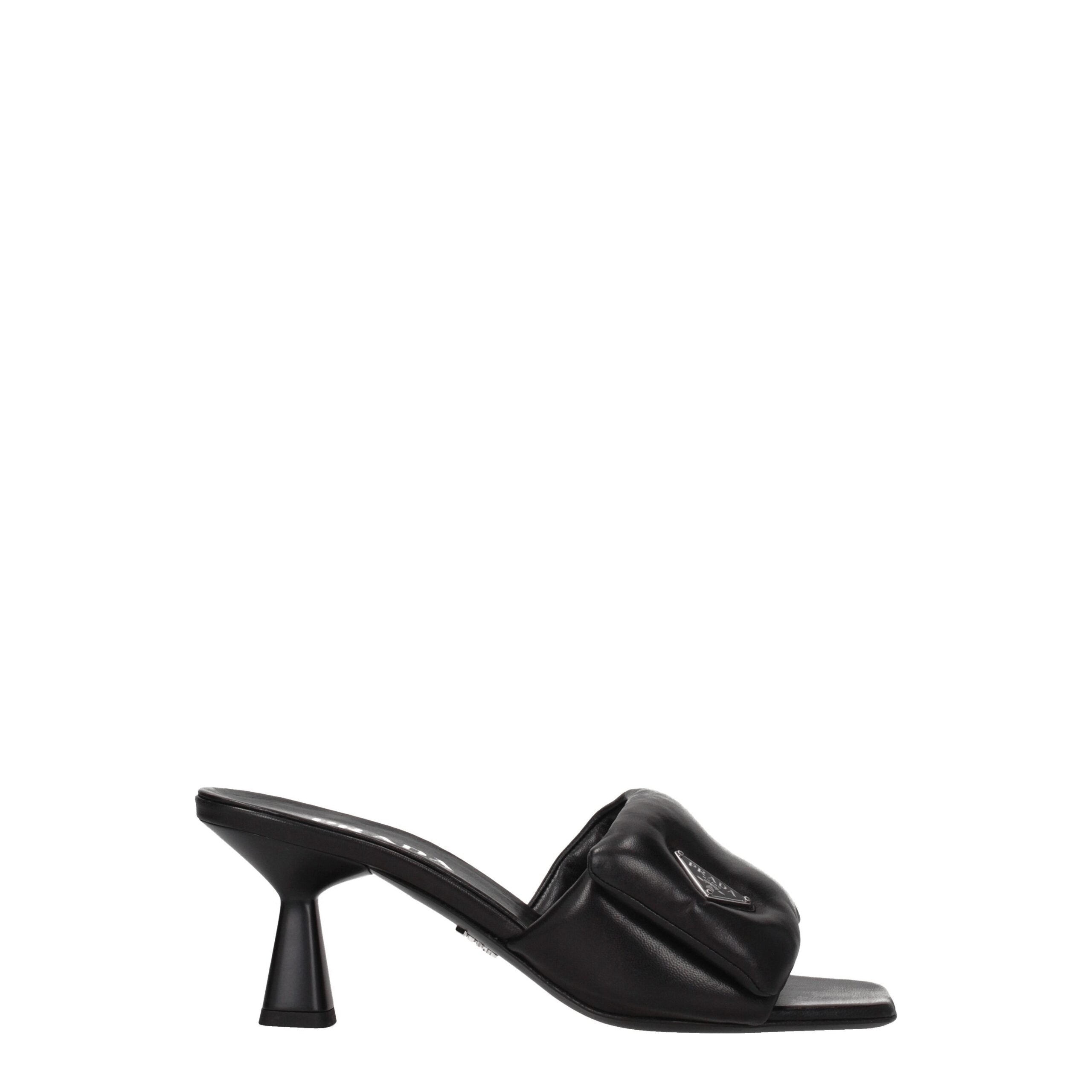 Black Leather Platform SandalsDescription: The product with MPN 1XX6542DL8065F0002 and code F76042 leather in black is a sandals designed by Prada. It has features like front logo. Additional Info: Style: Casual Materials: Leather Shoe sole: Leather Heel
