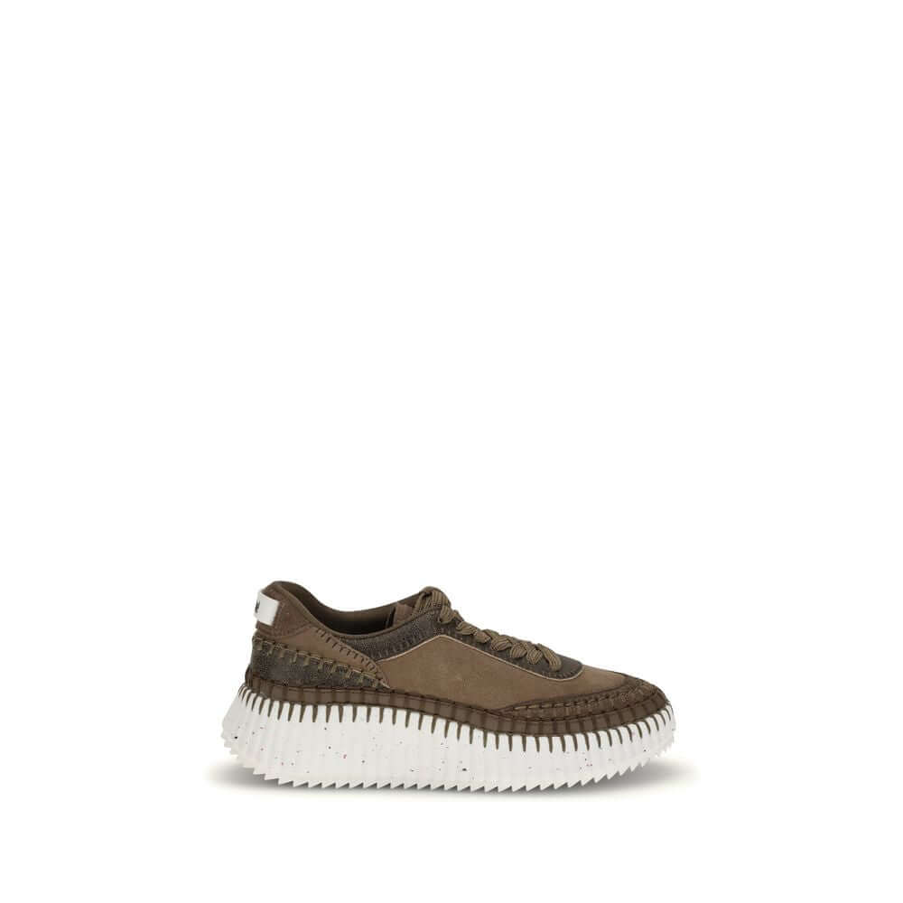Nama SneakersThe Nama Sneakers by Chloé are made from a mix of suede calfskin and cracked shearling leather. They feature an iconic sole made of recycled materials, lightweight and ultra-comfortable, with a dotted effect. Finished with delicate saddle sti