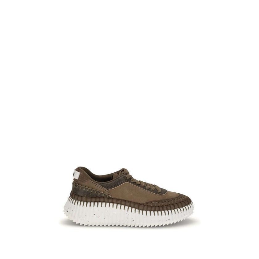 Nama SneakersThe Nama Sneakers by Chloé are made from a mix of suede calfskin and cracked shearling leather. They feature an iconic sole made of recycled materials, lightweight and ultra-comfortable, with a dotted effect. Finished with delicate saddle sti
