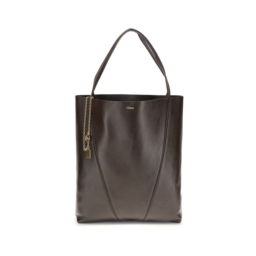 Brown Calf Leather Bos Taurus Shoulder BagChloé’s Spin Large Tote Bag is crafted in glossy garnet cowhide and features a minimalist silhouette with graphic and elegant lines. A distinctive detail is the hanging chain with Chloé medals and the Horse emblem