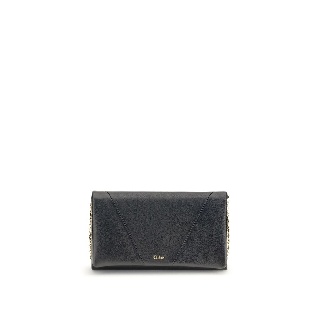 Black Calf Leather Bos Taurus WalletThe Spin Wallet with Flap and Chain by Chloé is crafted from garnet buffalo leather with an interior of buffalo leather and a polyester-cotton blend fabric. Equipped with a chain shoulder strap, it can be worn crossbody