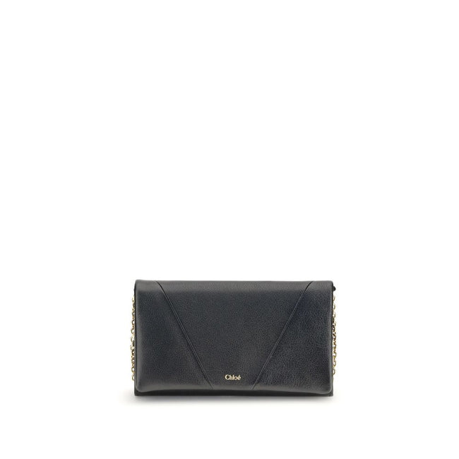 Black Calf Leather Bos Taurus WalletThe Spin Wallet with Flap and Chain by Chloé is crafted from garnet buffalo leather with an interior of buffalo leather and a polyester-cotton blend fabric. Equipped with a chain shoulder strap, it can be worn crossbody