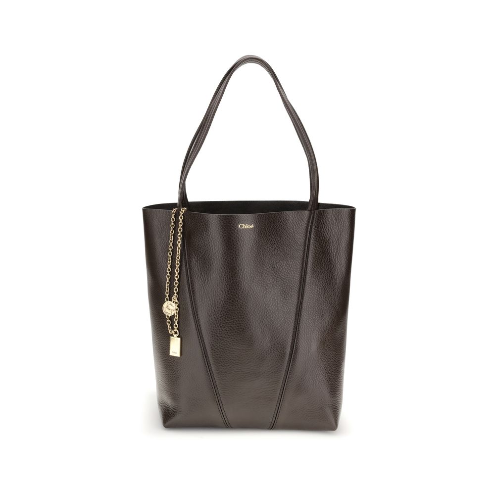Brown Calf Leather Bos Taurus Shoulder BagLeather Spin Shoulder Bag by Chloé is a refined and modern accessory featuring a sleek grained leather design. The two flat top handles offer a comfortable and practical grip, while the brand’s iconic monogram, pr