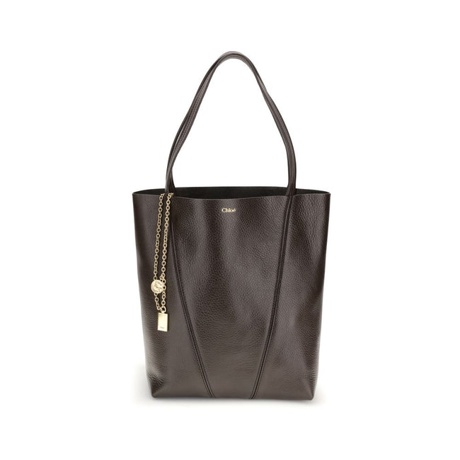 Brown Calf Leather Bos Taurus Shoulder BagLeather Spin Shoulder Bag by Chloé is a refined and modern accessory featuring a sleek grained leather design. The two flat top handles offer a comfortable and practical grip, while the brand’s iconic monogram, pr