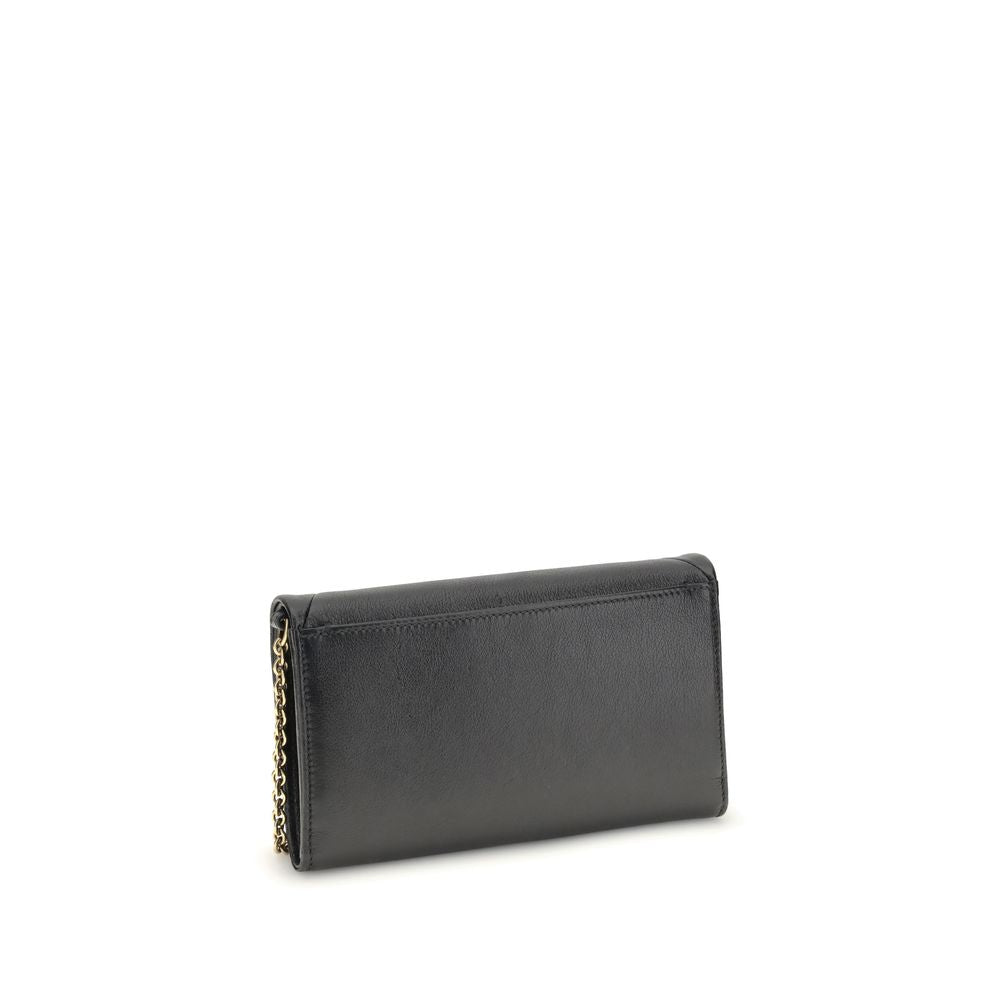 Black Calf Leather Bos Taurus WalletThe Spin Wallet with Flap and Chain by Chloé is crafted from garnet buffalo leather with an interior of buffalo leather and a polyester-cotton blend fabric. Equipped with a chain shoulder strap, it can be worn crossbody