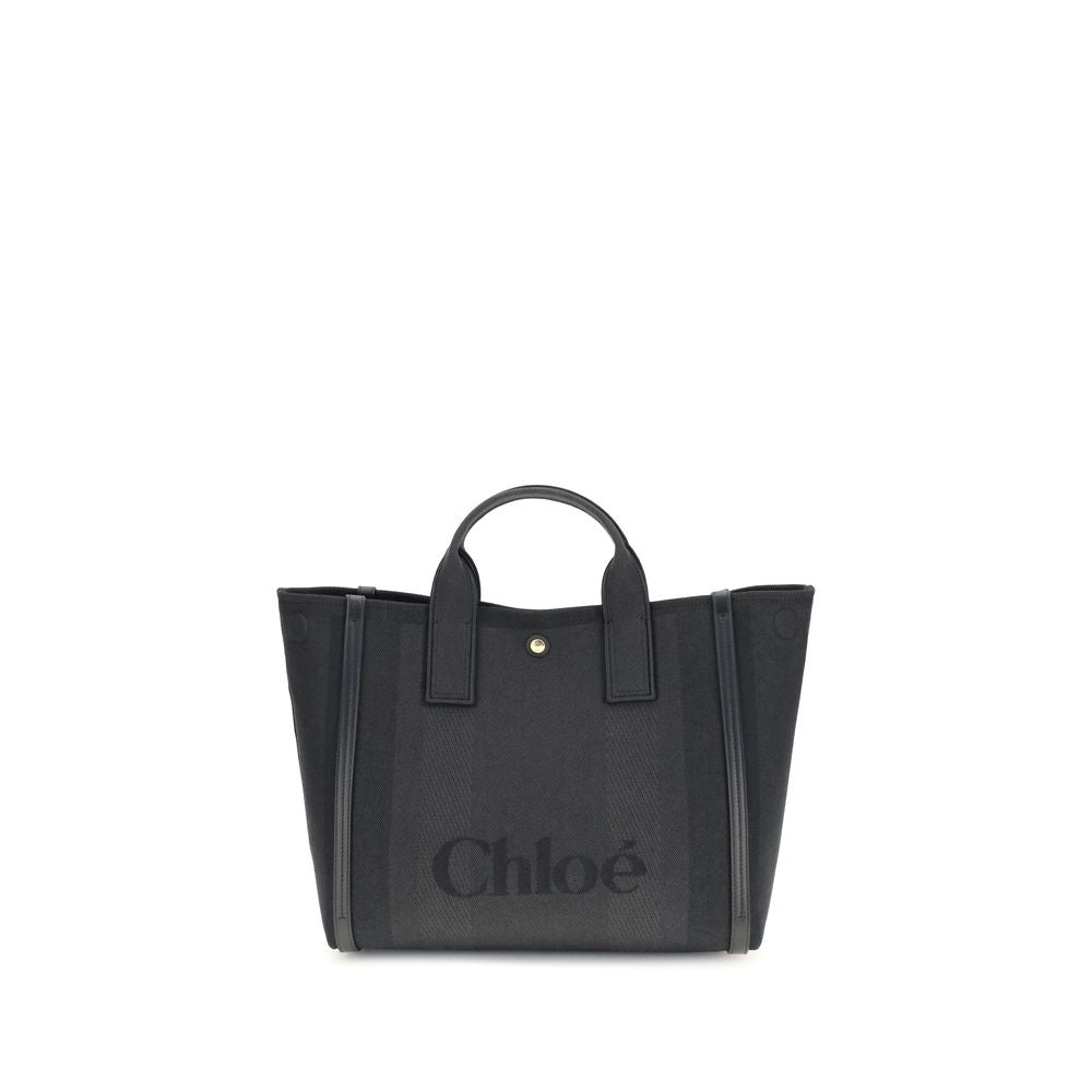 Black Cotton HandbagChloé’s Carry Handbag is a refined and versatile accessory made of cotton with contrasting leather details that accentuate its elegance. The snap top closure provides practicality, while the double flat handles and leather extension on