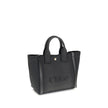 Black Cotton Shoulder BagChloé’s Carry Tote Bag is a stylish, multifunctional accessory made of cotton with contrasting leather details that accentuate its sophisticated appeal. Magnetic buttons on the side panels allow you to adjust the width of the bag