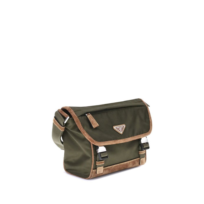 Green Recycled Polyamide Shoulder BagPrada’s Medium Shoulder Bag, made of innovative Re-Nylon and suede leather, is a combination of style and functionality. The ribbon shoulder strap is adjustable, offering versatility in carrying it. The iconic enameled