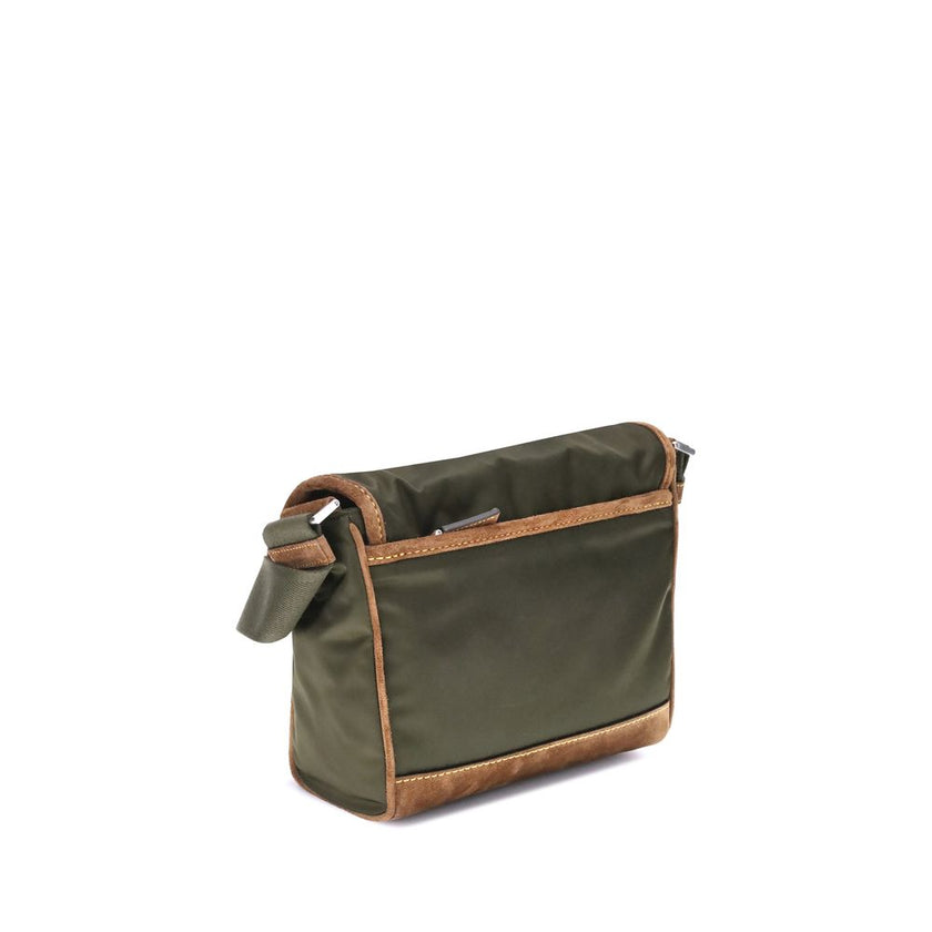 Green Recycled Polyamide Shoulder BagPrada’s Medium Shoulder Bag, made of innovative Re-Nylon and suede leather, is a combination of style and functionality. The ribbon shoulder strap is adjustable, offering versatility in carrying it. The iconic enameled