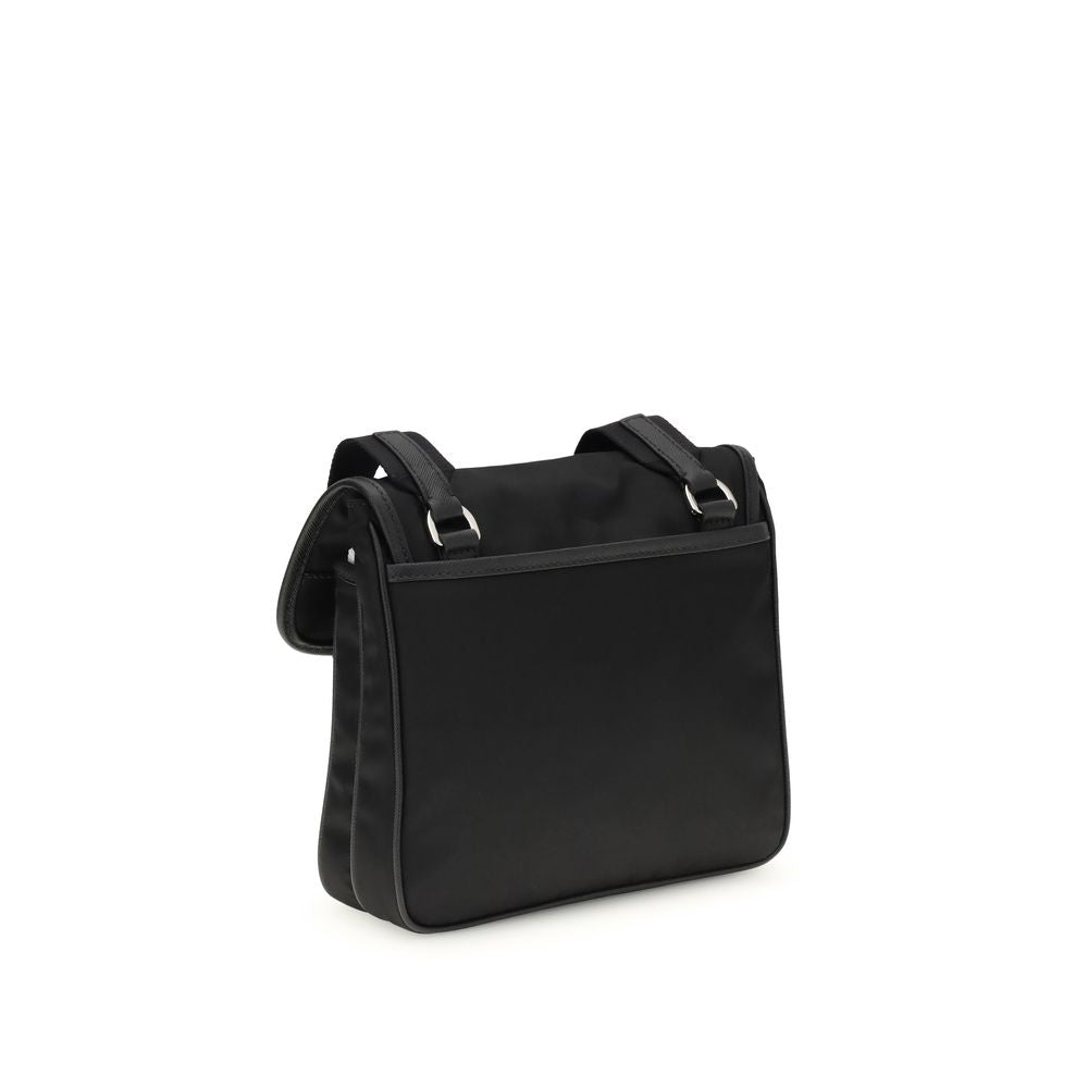 Black Recycled Polyamide Shoulder BagPrada’s re-nylon and saffiano Shoulder Bag combines contemporary style and practicality. It features an adjustable ribbon and leather shoulder strap, a flap closure and snap system, and has an enameled metal triangle l