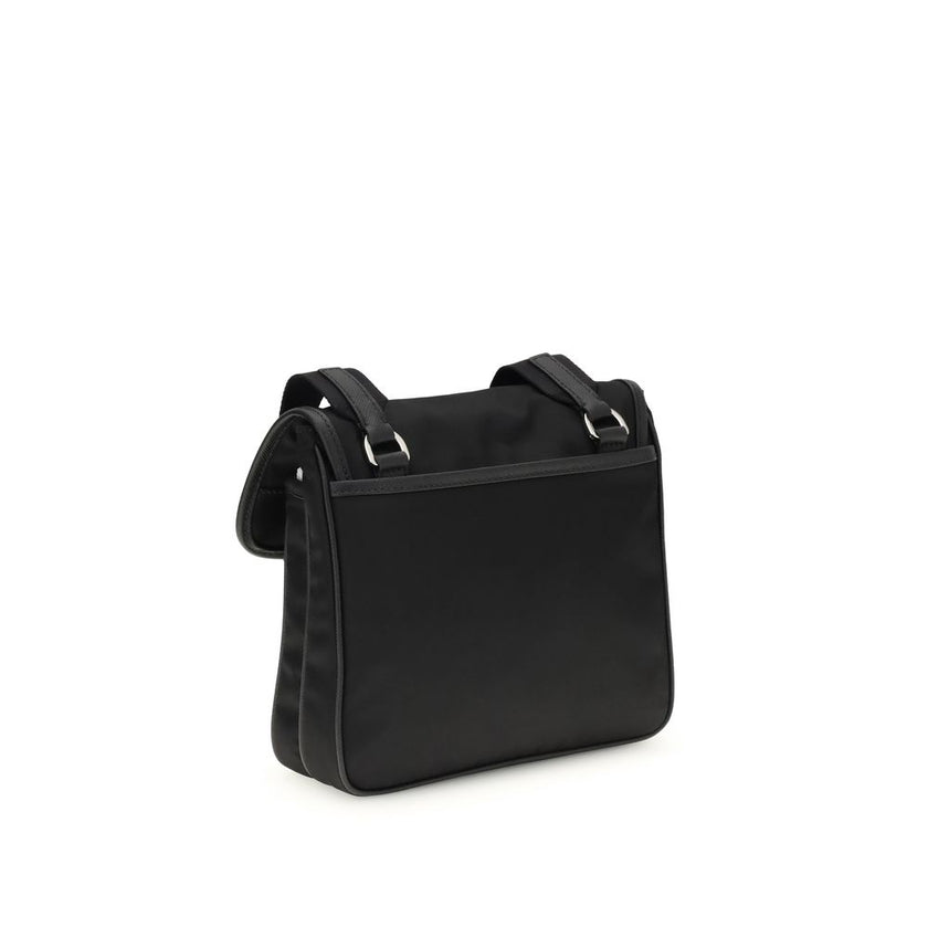 Black Recycled Polyamide Shoulder BagPrada’s re-nylon and saffiano Shoulder Bag combines contemporary style and practicality. It features an adjustable ribbon and leather shoulder strap, a flap closure and snap system, and has an enameled metal triangle l